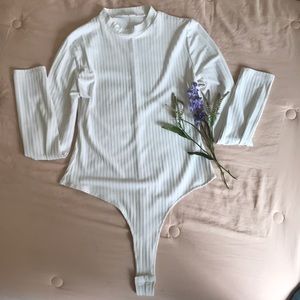 White turtleneck bodysuit